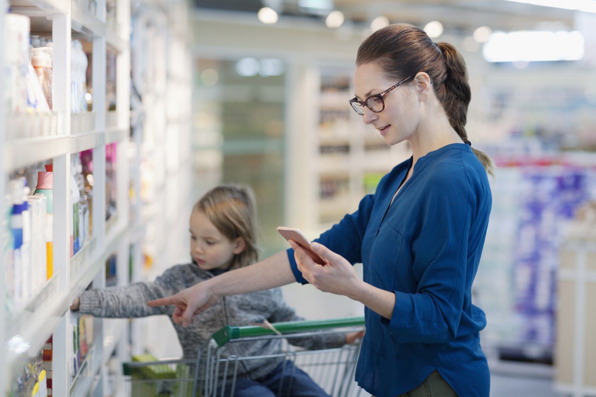 Mother and child shopping in a pharmacy